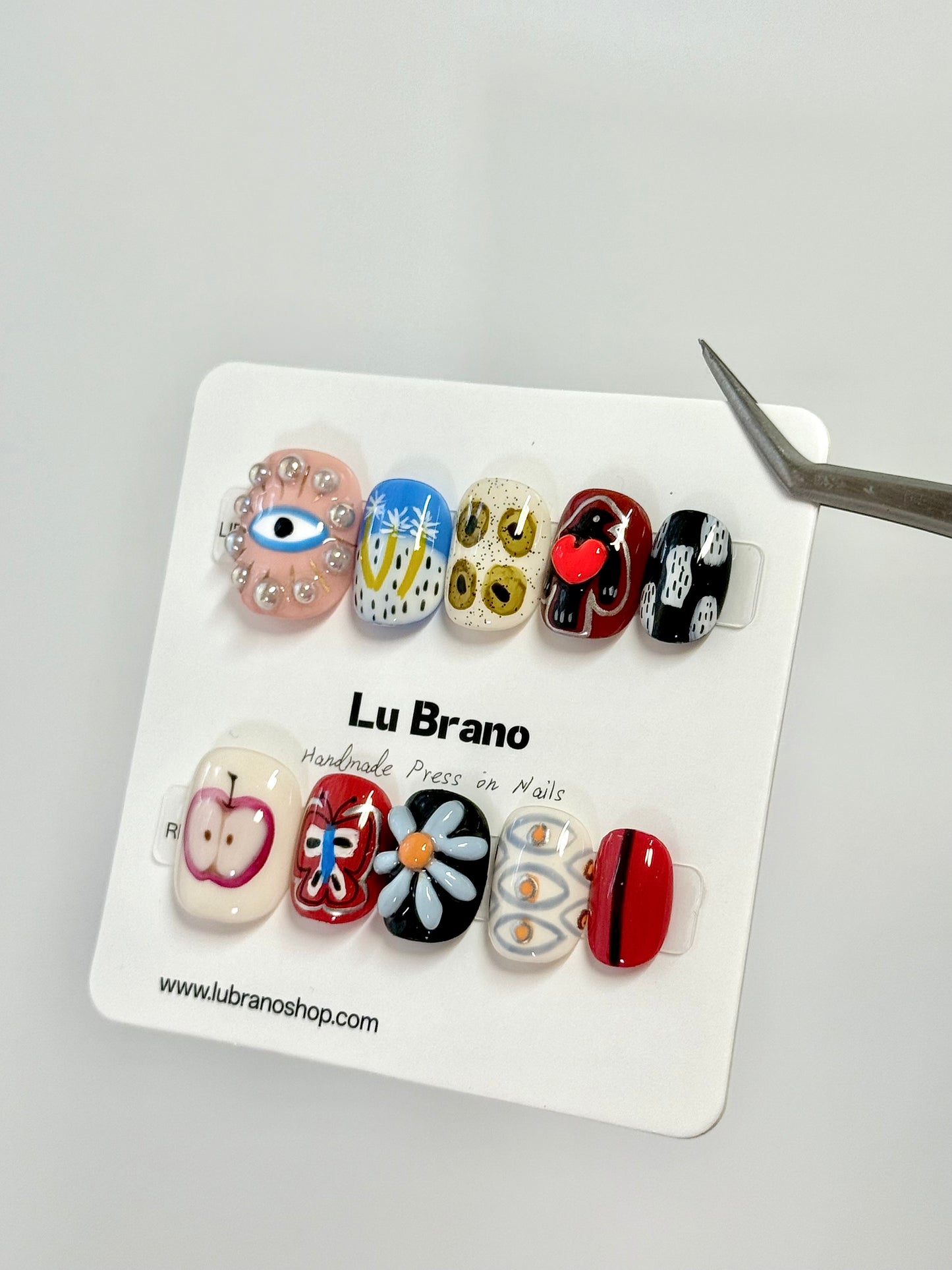 Abstract Muse | Hand-Painted Designs | Short Squoval Shape | Niche Aesthetic | Work-Friendly | Versatile & Cute | Evil Eye Nails | Heart & Apple Motifs | Butterfly & 3D Florals | Premium Press-On Nails | Handmade Artistry